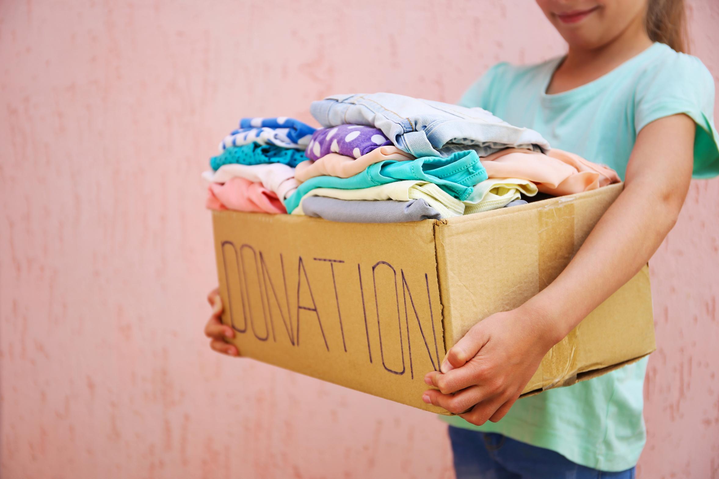 Child receiving free clothing from our closet