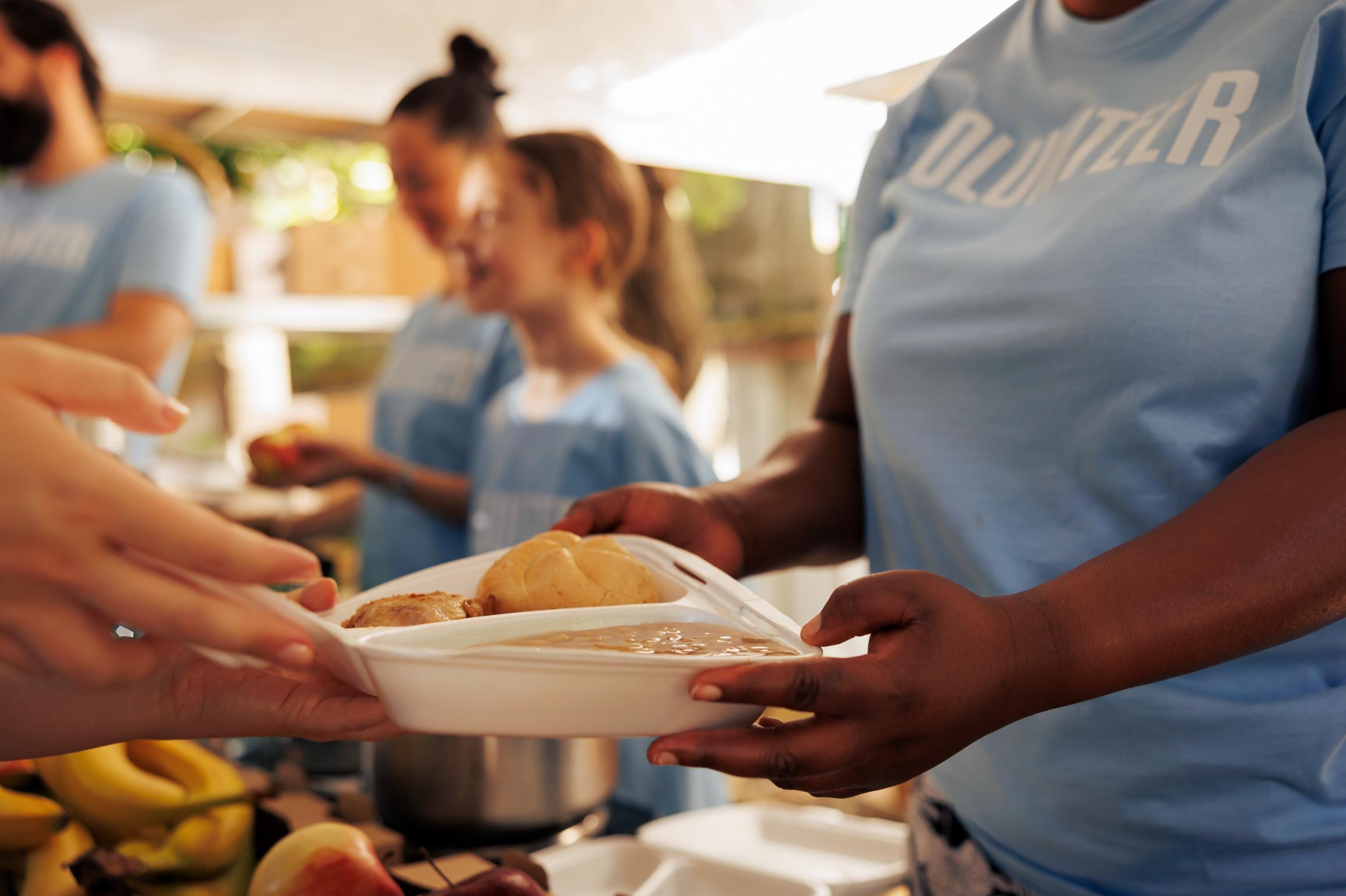 Community members enjoying a meal together at The Cookhouse